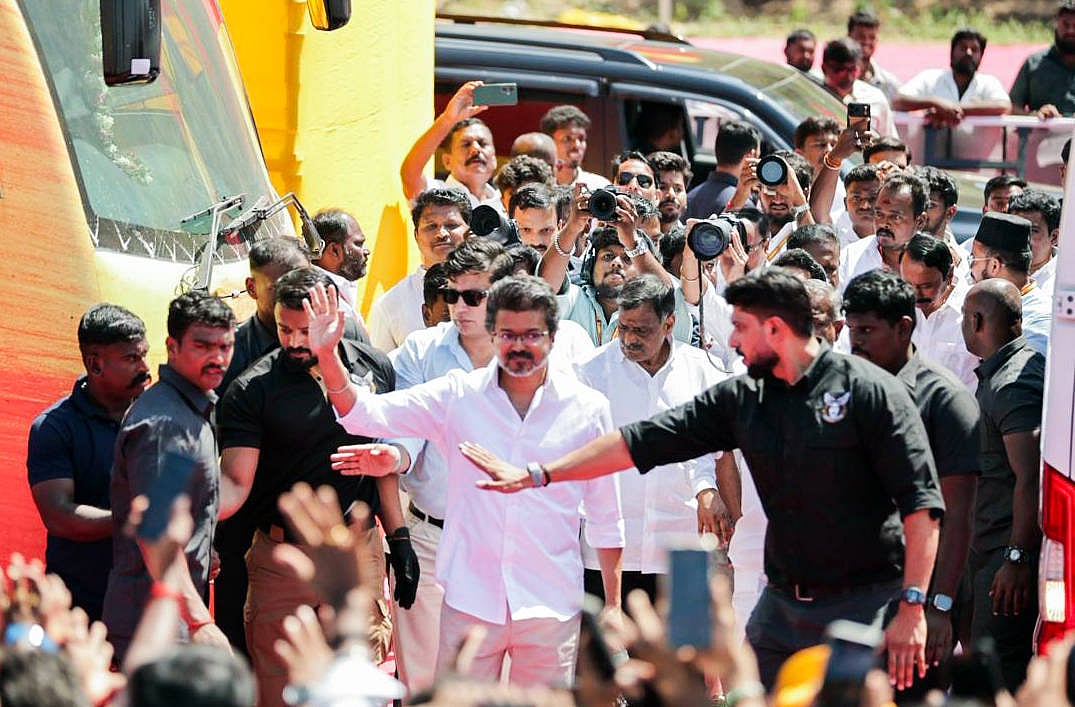 Tamilaga Vettri Kazhagam (TVK) President Vijay waves as he arrives for the public meeting in the Salem district, Tamil Nadu