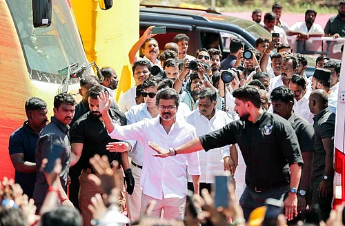 Tamilaga Vettri Kazhagam (TVK) President Vijay waves as he arrives for the public meeting in the Salem district, Tamil Nadu