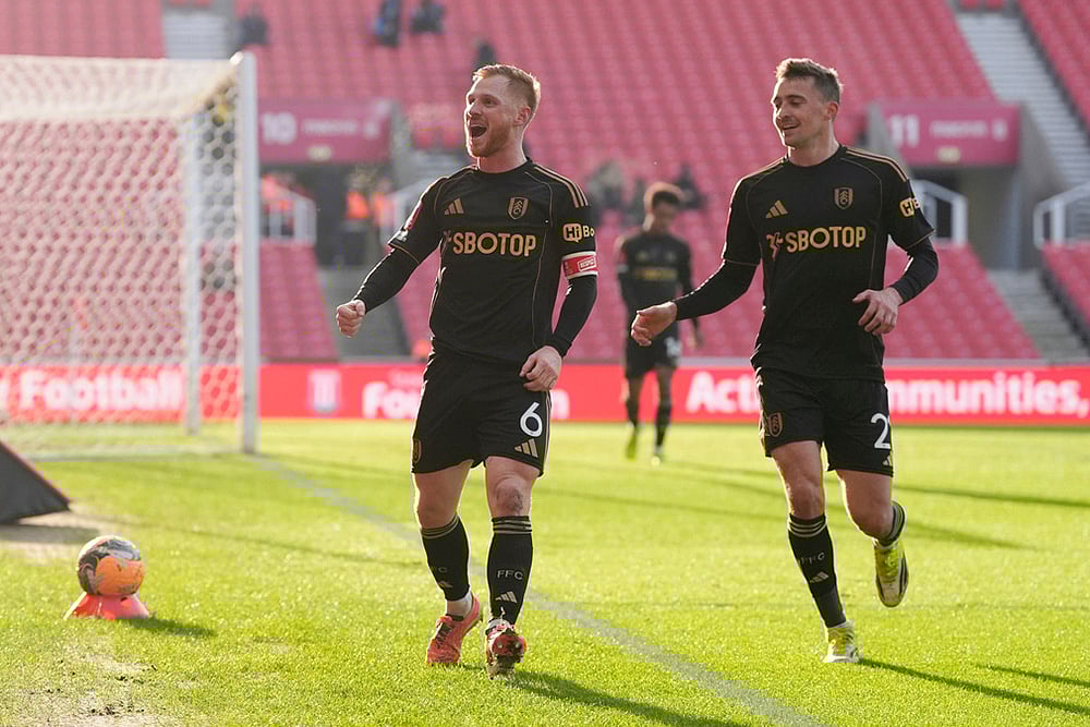 | Photo: Nick Potts/PA via AP : Fulhams Harrison Reed, left, celebrates with Timothy Castagne after scoring his sides second goal  during the English FA Cup fourth round match between Stoke City and Fulham, in Stoke, England.