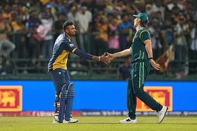 | Photo: AP/Eranga Jayawardena : Sri Lankas captain Dasun Shanaka, left, shake hands with Australias captain Mitchell Marsh after they won the T20 World Cup cricket match against Australia in Pallekele, Sri Lanka.