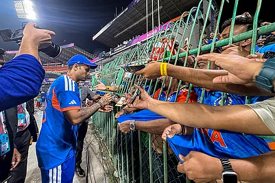 | Photo: PTI/Arun Sharma : Indias captain Suryakumar Yadav signs autographs for fans after winning the ICC Mens T20 World Cup 2026 cricket match between India and Pakistan, at R Premadasa Stadium, in Colombo, Sri Lanka.