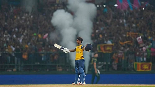 Photo: AP/Eranga Jayawardena : Sri Lankas Pathum Nissanka celebrates his century during the T20 World Cup cricket match between Sri Lanka and Australia in Pallekele, Sri Lanka.