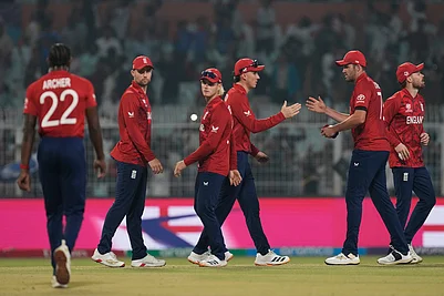 | Photo: AP/Bikas Das : Englands captain Harry Brook, centre, celebrates with teammates after winning the T20 World Cup cricket match against Italy in Kolkata, India.