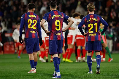 | Photo: AP/Joan MonfortJoan Monfort : Barcelonas Frenkie de Jong, Marc Bernal and Robert Lewandowski react as Girona player celebrate after winning a Spanish La Liga soccer match between Girona and Barcelona in Girona, Spain.