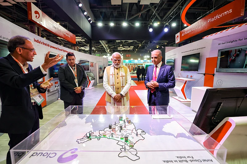 Source: PTI :
In this image received on Feb. 16, 2026, Prime Minister Narendra Modi during the inauguration of India AI Impact Expo, at Bharat Mandapam in New Delhi. Bharti Enterprises Chairman Sunil Bharti Mittal also seen. (PMO via PTI Photo)