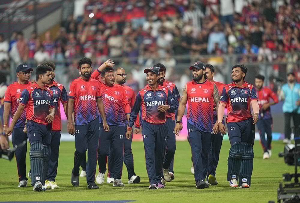| Photo: AP/Rafiq Maqbool : Nepal cricket team walks back to the pavilion after defeating Scotland during the T20 World Cup cricket match in Mumbai.