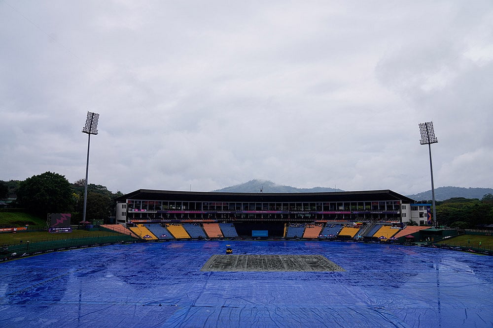 | Photo: AP/Eranga Jayawardena : The ground is covered as rain delayed the start of play during the T20 World Cup cricket match between Ireland and Zimbabwe in Pallekele, Sri Lanka.