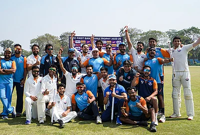| Photo: PTI/Manvender Vashist Lav : Jammu and Kashmir players with their coach and support staff pose for a group photo after their victory in the Ranji Trophy semifinal cricket match against Bengal, at the Bengal Cricket Academy Ground, in Kalyani, West Bengal.