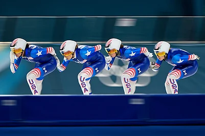 | Photo: AP/Ben Curtis : Team USA practices ahead of the semifinal of the womens team pursuit speedskating race at the 2026 Winter Olympics, in Milan, Italy.