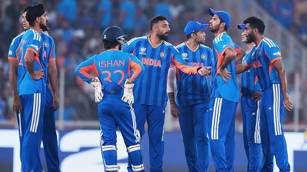 AP : Indias Varun Chakravarthy, centre, celebrates with teammates the wicket of Netherlands Max ODowd during their T20 World Cup match in Ahmedabad.