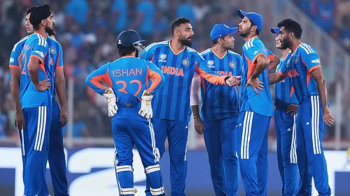 AP : Indias Varun Chakravarthy, centre, celebrates with teammates the wicket of Netherlands Max ODowd during their T20 World Cup match in Ahmedabad.