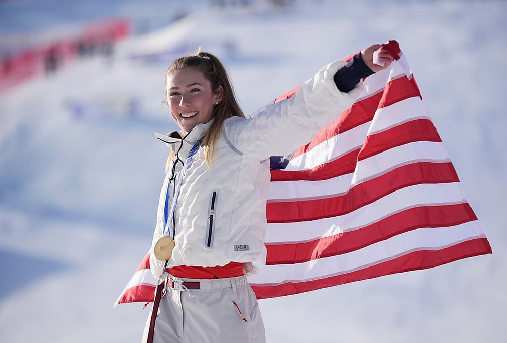 | Photo: AP/Jacquelyn Martin : United States Mikaela Shiffrin celebrates winning the gold medal in an alpine ski, womens slalom race, at the 2026 Winter Olympics, in Cortina dAmpezzo, Italy.