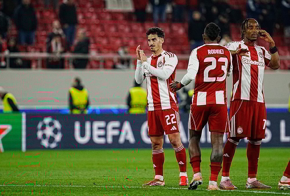 | Photo: AP/Petros Giannakouris : Players of Olympiacos are seen after the end of the Champions League playoff soccer match between Olympiacos and Bayer 04 Leverkusen in Piraeus port, near Athens.