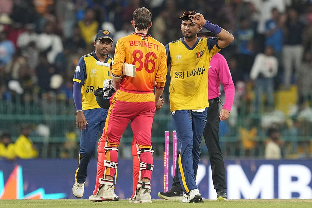 | Photo: AP/Eranga Jayawardena : Sri Lankas captain Dasun Shanaka, right, congratulate Zimbabwes Brian Bennett after Zimbabwe won the T20 World Cup cricket match in Colombo, Sri Lanka.