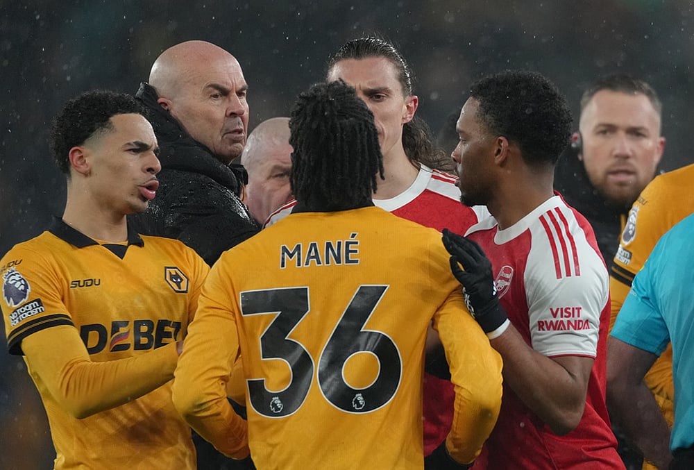 | Photo: AP/Dave Shopland : Wolverhampton Wanderers Mateus Mane, argues with Arsenals Riccardo Calafiori during the Premier League soccer match between Wolverhampton Wanderers and Arsenal in Wolverhampton, England.