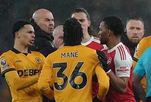 | Photo: AP/Dave Shopland : Wolverhampton Wanderers' Mateus Mane, argues with Arsenal's Riccardo Calafiori during the Premier League soccer match between Wolverhampton Wanderers and Arsenal in Wolverhampton, England.
