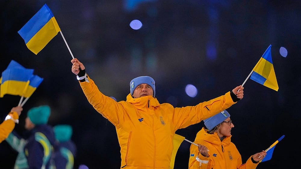 | Photo: AP/Ashley Landis : Athletes from Ukraine arrive during the Olympic opening ceremony at the 2026 Winter Olympics, in Milan, Italy.