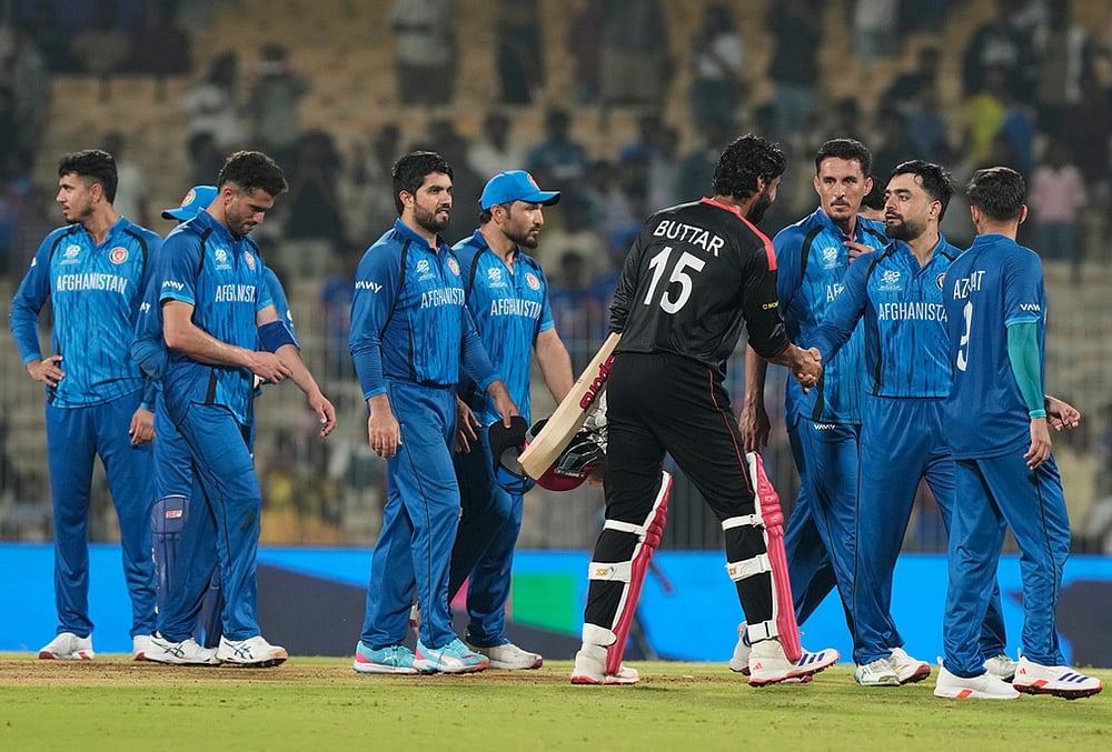 | Photo: AP/Mahesh Kumar A. : Afghanistans captain Rashid Khan, second right, shakes hands with Canadas Jaskarandeep Buttar after winning the T20 World Cup cricket match between Afghanistan and Canada in Chennai.