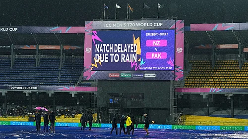 (AP Photo/Eranga Jayawardena) : A large screen announces a delay in the start of T20 World Cup cricket match between New Zealand and Pakistan due to rain, in Colombo, Sri Lanka, Saturday, Feb. 21, 2026.