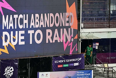 | Photo: AP/Eranga Jayawardena : Pakistans Usman Khan looks at a large screen announcing that the T20 World Cup cricket match between New Zealand and Pakistan is abandoned due to rain, in Colombo, Sri Lanka.