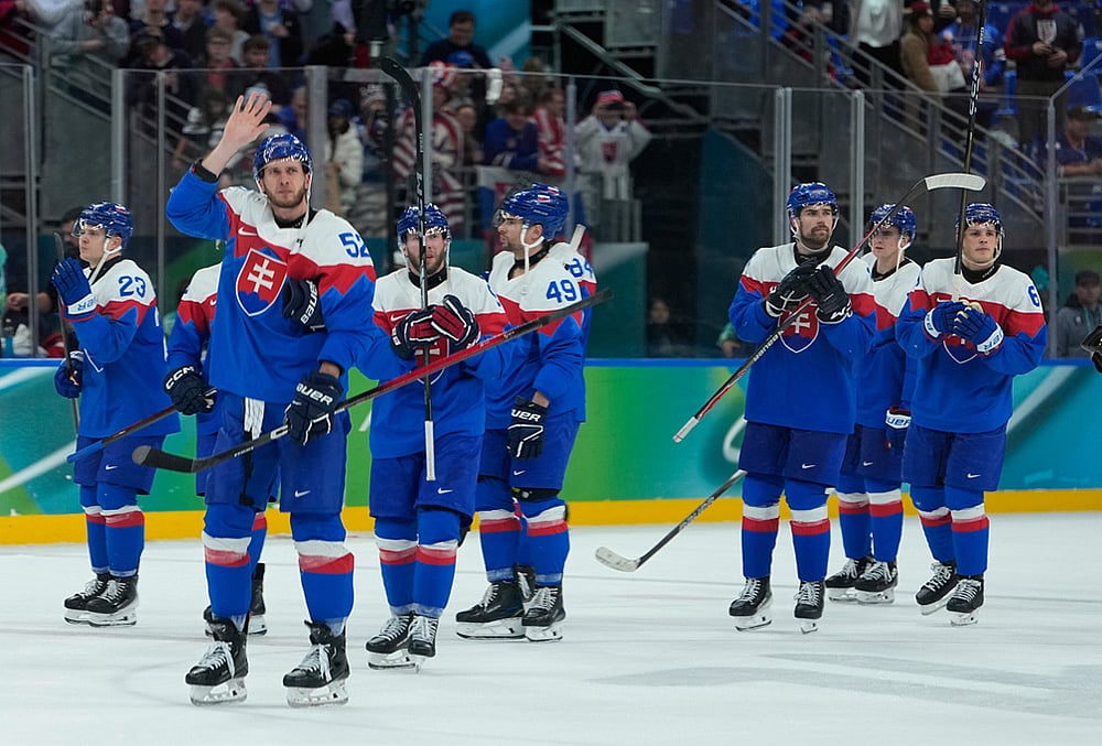 | Photo: AP/Petr David Josek : Slovakia players greet fans at the end of a mens ice hockey semifinal game between United States and Slovakia at the 2026 Winter Olympics, in Milan, Italy. 