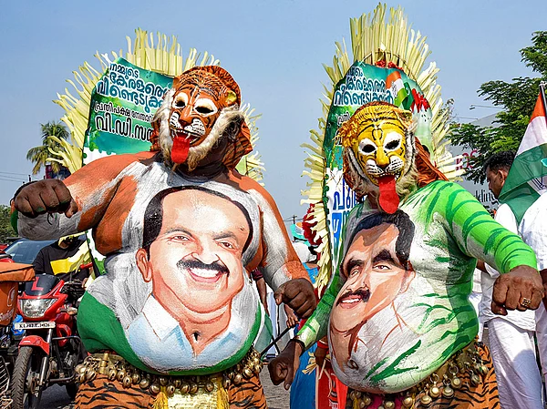 | Photo: PTI : Pulikali artists display paintings of leaders during a reception meeting at Aluva as part of the UDF Puthuyuga Yatra led by Opposition Leader VD Satheesan, in Kochi, rep image |