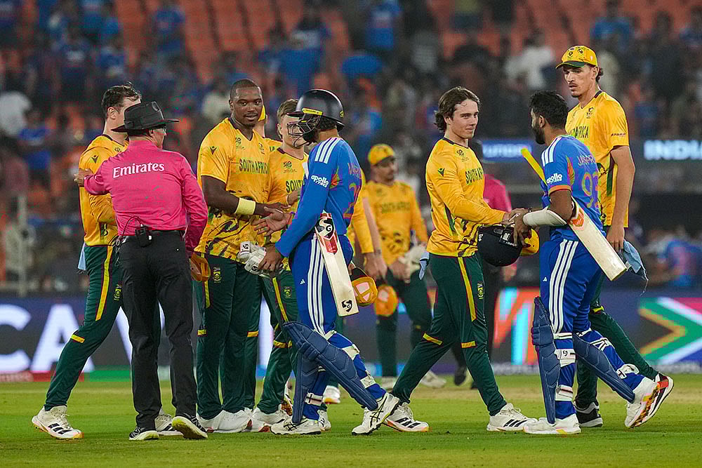 | Photo: PTI/Arun Sharma : South Africas players being congratulated by Indias Varun Chakravarthy and Jasprit Bumrah after winning the ICC Mens T20 World Cup 2026 cricket match between India and South Africa, at the Narendra Modi Stadium, in Ahmedabad.