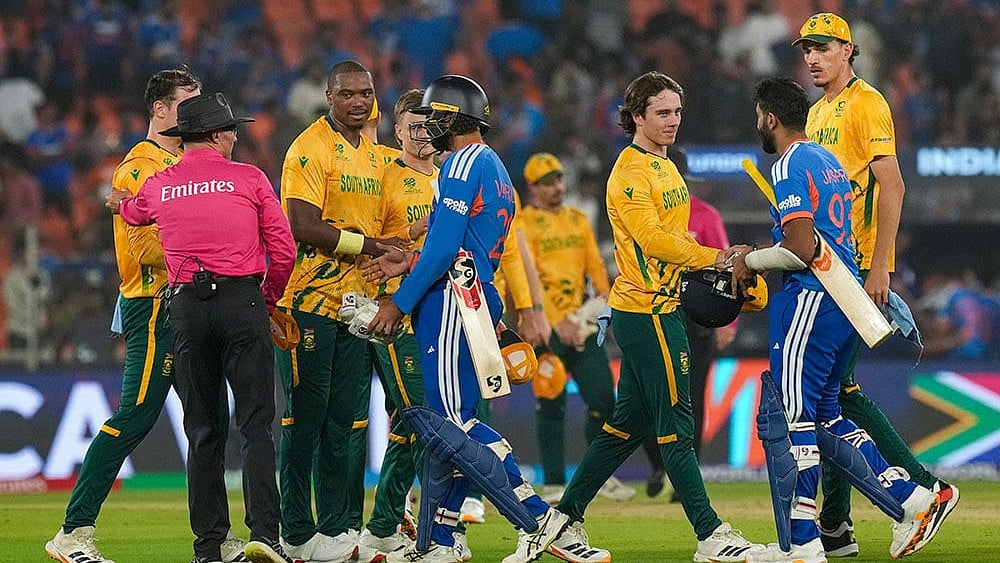 | Photo: PTI/Arun Sharma : South Africas players being congratulated by Indias Varun Chakravarthy and Jasprit Bumrah after winning the ICC Mens T20 World Cup 2026 cricket match between India and South Africa, at the Narendra Modi Stadium, in Ahmedabad.