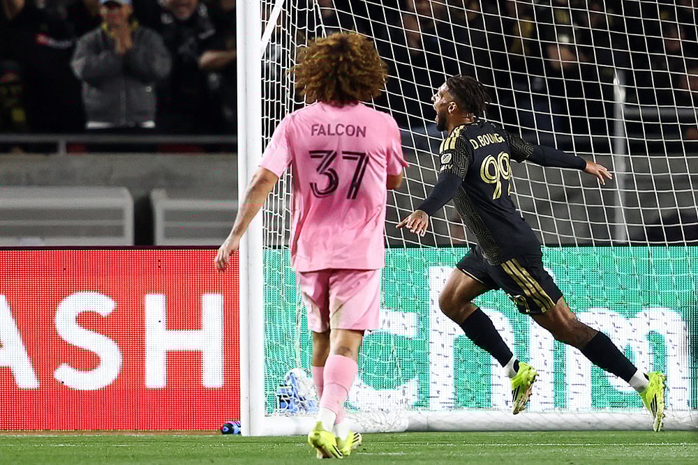 | Photo: AP/Jessie Alcheh : Los Angeles FC forward Denis Bouanga (99) celebrates after scoring a goal as Inter Miami defender Maximiliano Falcón (37) watches during the second half of an MLS soccer match in Los Angeles, Calif.
