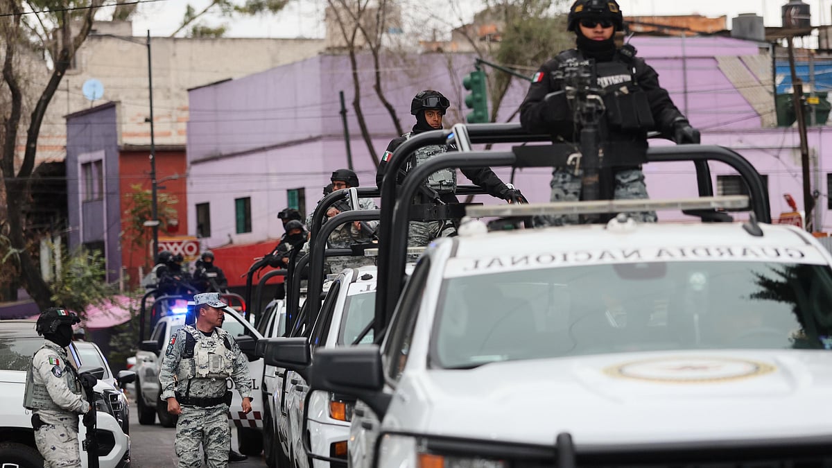 | Photo: AP/Ginette Riquelme : National Guards patrol the area outside of the General Prosecutor's headquarters in Mexico City, Sunday, Feb. 22, 2026, after authorities reported that the Mexican Army killed Jalisco New Generation Cartel leader Nemesio Oseguera Cervantes, known as "El Mencho."