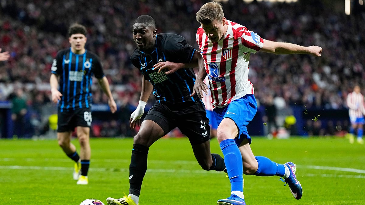 (AP Photo/Manu Fernandez) : Atletico Madrid's Alexander Sorloth, right, and Brugge's Joel Ordonez fight for the ball during the Champions League play-off second leg soccer match between Atletico Madrid and Club Brugge, in Madrid, Spain, Tuesday, Feb. 24, 2026