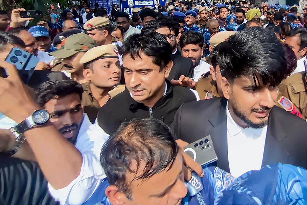 | Photo: PTI : Indian Youth Congress (IYC) national president Uday Bhanu Chib is taken into police custody after a hearing at Patiala House Court in connection with the AI Impact Summit protest case, in New Delhi.