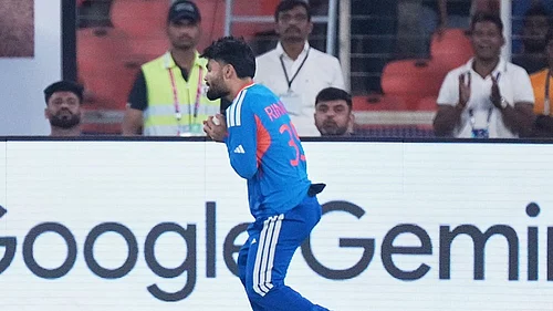 | Photo: AP/Ajit Solanki : Indias Rinku Singh takes the catch to dismiss Netherlands Colin Ackermann during the T20 World Cup cricket match between India and Netherlands in Ahmedabad.