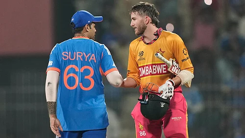 (AP Photo/Mahesh Kumar A.) : Indias captain Suryakumar Yadav, left, shake hands with Zimbabwes Brian Bennett after winning the T20 World Cup cricket match between India and Zimbabwe in Chennai, India, Thursday, Feb. 26, 2026