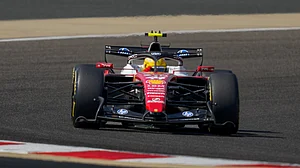| Photo: AP/Altaf Qadri : Ferrari driver Lewis Hamilton of Britain steers his car on the third day of Formula One pre-season test at the Bahrain International Circuit in Sakhir, Bahrain, Friday, Feb. 13, 2026.