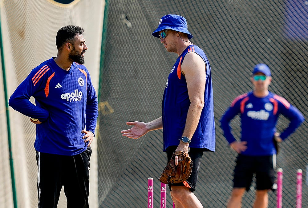 | Photo: PTI/R Senthilkumar : Indias Varun Chakaravarthy, left, during a training session ahead of the ICC Mens T20 World Cup 2026 cricket match between India and Zimbabwe, at MA Chidambaram Stadium, in Chennai.