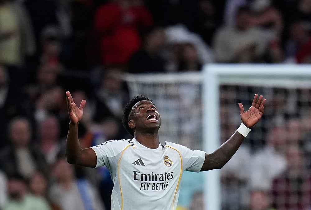 | Photo: AP/Manu Fernandez : Real Madrids Vinicius Junior celebrates after scoring his sides second goal during the second leg of the Champions League playoff soccer match between Real Madrid and Benfica in Madrid, Spain.