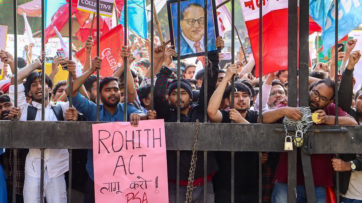 Source: PTI : Members of the Jawaharlal Nehru University Students Union (JNUSU) stage a protest rally towards the Ministry of Education for stronger implementation of University Grants Commission regulations and enactment of the Rohith Vemula Act, in New Delhi, Thursday, Feb. 26, 2026