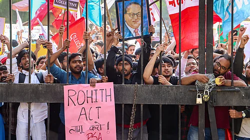 Source: PTI : Members of the Jawaharlal Nehru University Students Union (JNUSU) stage a protest rally towards the Ministry of Education for stronger implementation of University Grants Commission regulations and enactment of the Rohith Vemula Act, in New Delhi, Thursday, Feb. 26, 2026