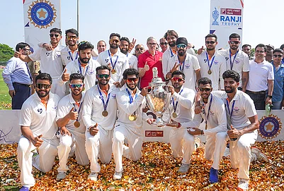 | Photo: PTI/Shailendra Bhojak : Jammu and Kashmir Chief Minister Omar Abdullah poses with players during the felicitation ceremony after the teams victory in the Ranji Trophy 2025-26 final cricket match against Karnataka, at KSCA Stadium, in Hubballi, Karnataka.