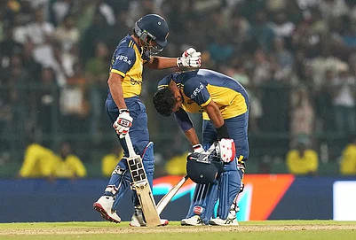 | Photo: AP/Eranga Jayawardena : Sri Lankas captain Dasun Shanaka, right, is consoled by teammate Dunith Wellalage after losing the T20 World Cup cricket match against Pakistan in Pallekele, Sri Lanka.