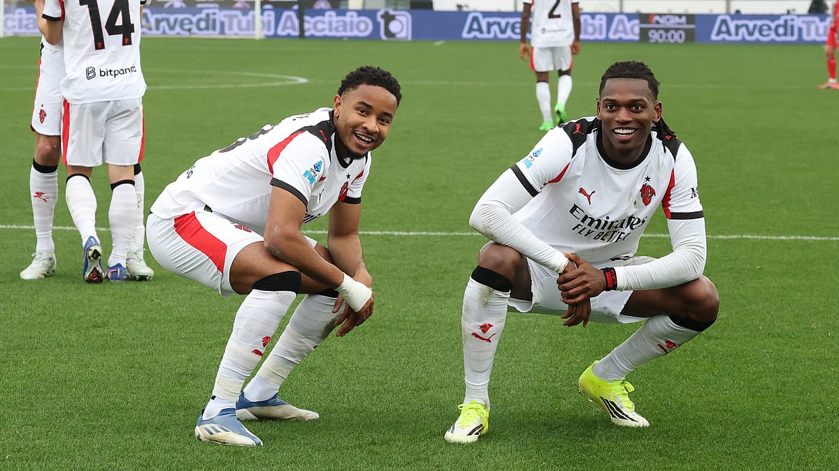 Christopher Nkunku and Rafael Leao celebrate the latter's goal