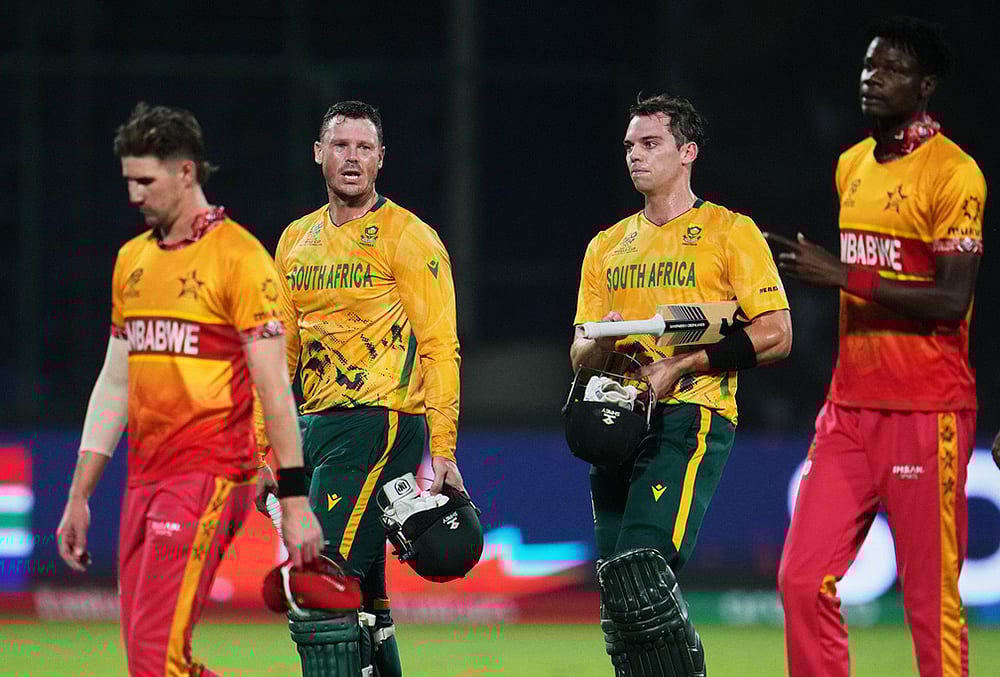 | Photo: AP/Manish Swarup : South Africas Tristan Stubbs and George Linde, centre, walk off the field after winning the T20 World Cup cricket match between South Africa and Zimbabwe in New Delhi.