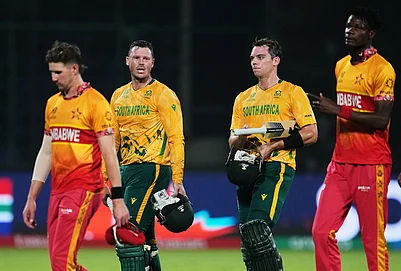 | Photo: AP/Manish Swarup : South Africas Tristan Stubbs and George Linde, centre, walk off the field after winning the T20 World Cup cricket match between South Africa and Zimbabwe in New Delhi.