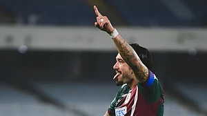 IndSuperLeague/X : Mohun Bagan Super Giant footballer Dimitri Petratos celebrating after scoring against Mohammedan Sporting in ISL 2025-26 Kolkata derby.
