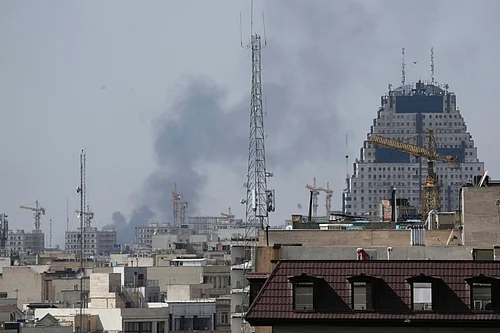 AP Photo : Smoke rises on the skyline after an explosion in Tehran, Iran, Saturday, Feb. 28, 2026.
