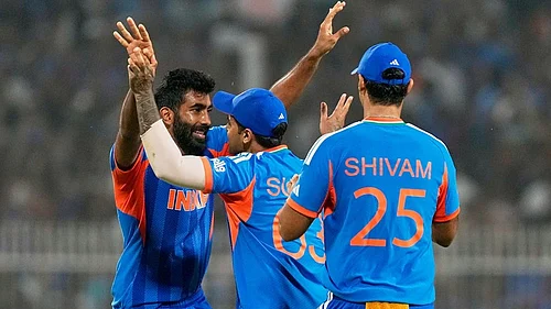 | Photo: AP/Bikas Das : Indias Jasprit Bumrah, left, celebrates with captain Suryakumar Yadav the wicket of West Indies Roston Chase during the T20 World Cup cricket match between India and West Indies in Kolkata.