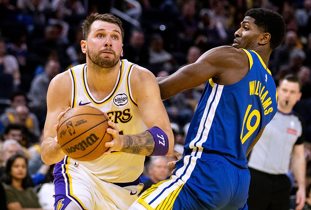 | Photo: Stephen Lam/San Francisco Chronicle via AP : Los Angeles Lakers guard Luka Doncic (77) drives past Golden State Warriors guard Nate Williams (19) during the third quarter of their NBA basketball game in San Francisco. 