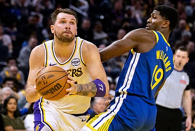 | Photo: Stephen Lam/San Francisco Chronicle via AP : Los Angeles Lakers guard Luka Doncic (77) drives past Golden State Warriors guard Nate Williams (19) during the third quarter of their NBA basketball game in San Francisco.