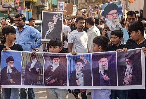 | Photo: PTI : People hold portraits of Irans Supreme Leader Ayatollah Ali Khamenei during a protest following his alleged killing in a US-Israel strike, in Patna.